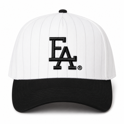 White and black pinstripe baseball cap featuring a bold black embroidered “FLA®” logo on the front, black curved brim, and classic vintage-inspired pinstripe design.