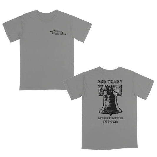 Grey vintage-inspired patriotic graphic tee celebrating 250 years of American freedom, featuring a distressed Liberty Bell back design with “Let Freedom Ring 1776–2026” and a subtle matching front chest emblem.