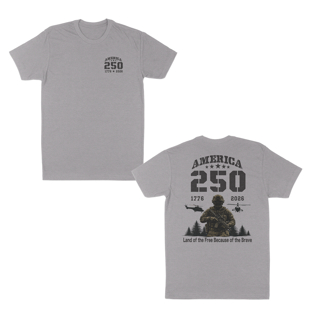 Heather grey patriotic military t-shirt featuring a small “America 250” chest print and oversized back graphic with armed soldier, helicopters, “1776–2026” anniversary text, and “Land of the Free Because of the Brave” design.