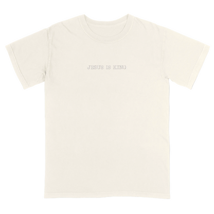 Ivory t-shirt with 'Jesus Is King' text on a white background