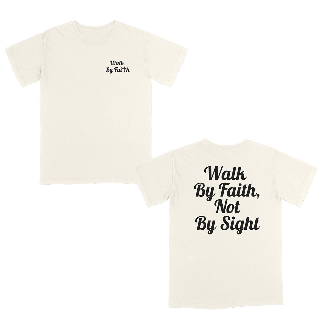 Front and back view of a ivory faith-based graphic t-shirt featuring “Walk By Faith” text on the chest and oversized “Walk By Faith, Not By Sight” typography on the back in white script lettering.