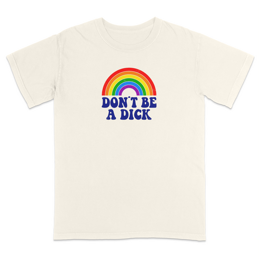 Front view of an ivory graphic T-shirt featuring a retro-style rainbow above the bold navy phrase "DON'T BE A DICK." This vintage-inspired humor tee combines colorful retro aesthetics with a funny, blunt message, making it perfect for casual everyday wear and conversation-starting style.