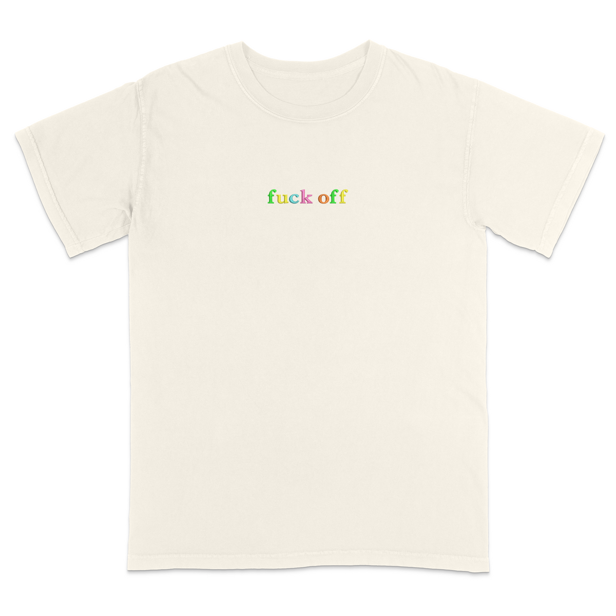 Front view of a ivory T-shirt featuring the phrase "fuck off" in small lowercase letters across the chest. Each letter is embroidered in a different bright color, creating a subtle rainbow-inspired design with a minimalist aesthetic. A bold statement tee for adults with a sarcastic sense of humor, casual streetwear style, and colorful typography.