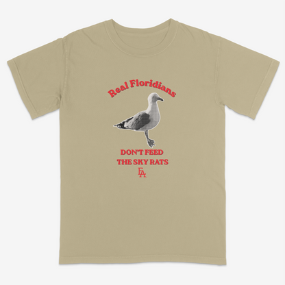 Khaki t-shirt with a seagull graphic and text on a white background