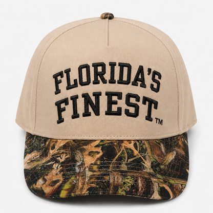 Florida’s Finest embroidered camo snapback hat featuring bold black lettering, khaki crown, realistic woodland camouflage curved brim, structured fit, and outdoor-inspired Florida lifestyle design.