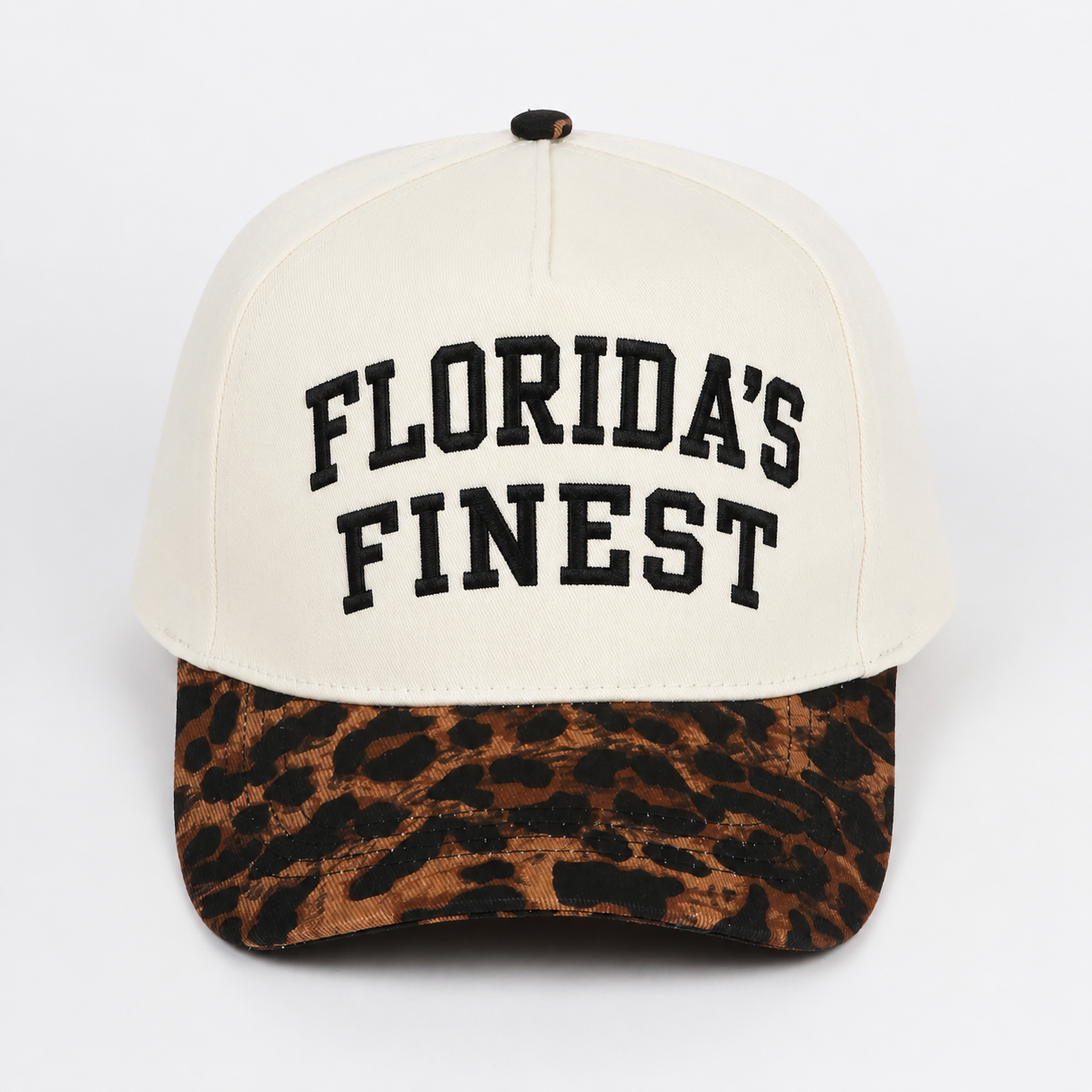 Florida’s Finest embroidered snapback hat featuring bold black lettering, cream crown, leopard print curved brim, structured fit, and stylish Florida-inspired casual design.