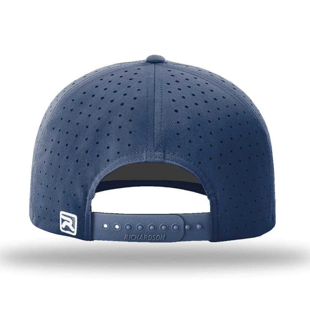 Medium blue perforated performance snapback cap back view featuring breathable micro-perforated panels, adjustable snap closure, and Richardson branding on the strap.