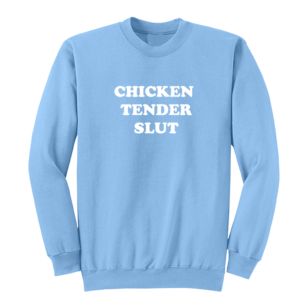 Front view of a light blue crewneck sweatshirt featuring the bold white stacked phrase "CHICKEN TENDER SLUT" in large retro bubble lettering centered on the chest. The simple vintage-inspired typography stands out against the black fabric, creating a humorous foodie-themed graphic sweatshirt with a clean, minimalist, and playful design.