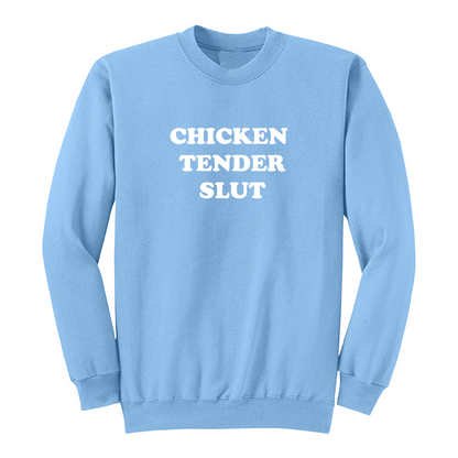Front view of a light blue crewneck sweatshirt featuring the bold white stacked phrase "CHICKEN TENDER SLUT" in large retro bubble lettering centered on the chest. The simple vintage-inspired typography stands out against the black fabric, creating a humorous foodie-themed graphic sweatshirt with a clean, minimalist, and playful design.