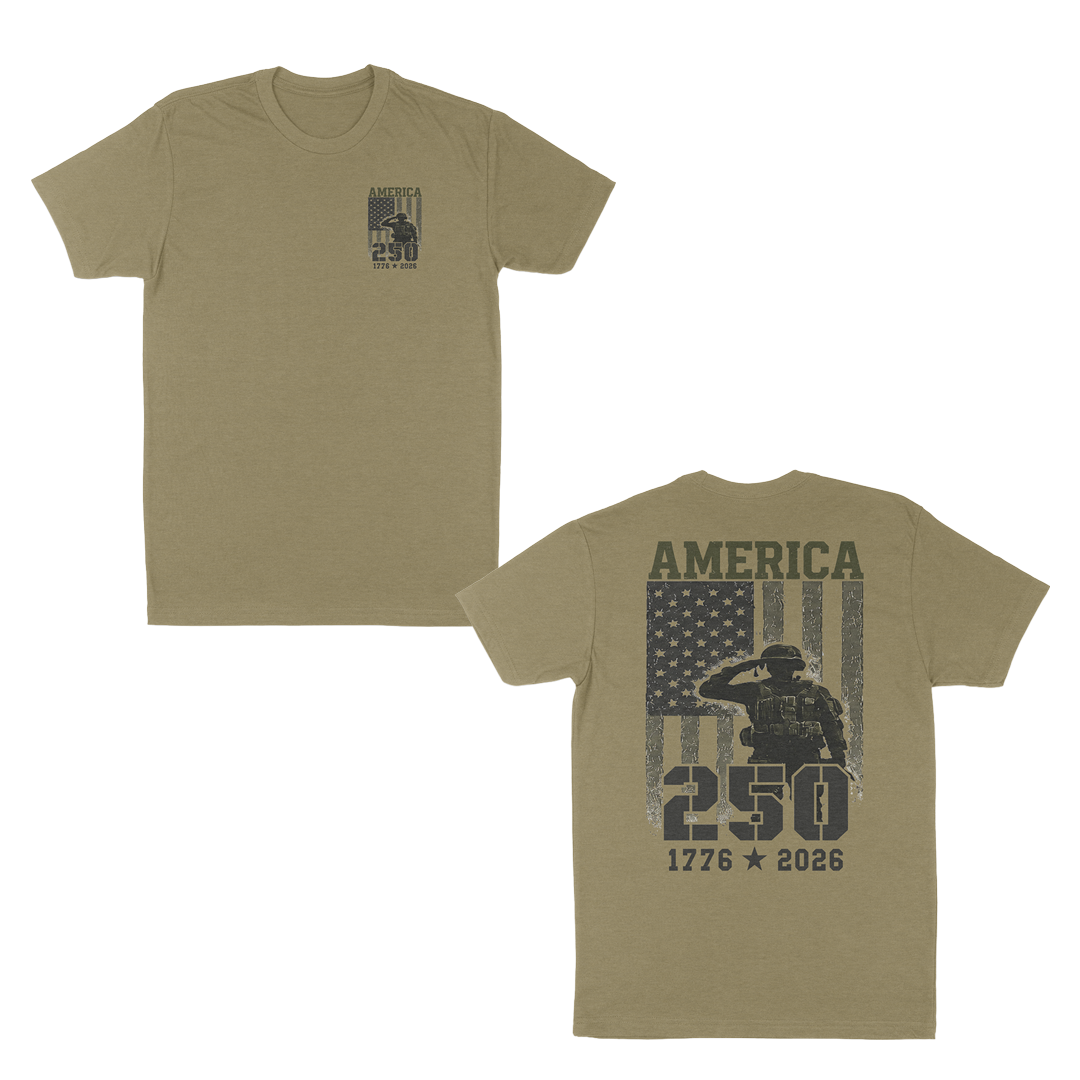 Light olive patriotic military graphic t-shirt featuring a small “America 250” chest print and large back design with saluting soldier, distressed American flag, and “1776–2026” anniversary artwork.