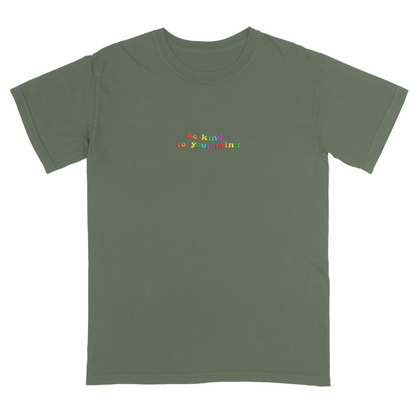 Moss green t-shirt with 'be kind to your mind' text in colorful letters on a white background