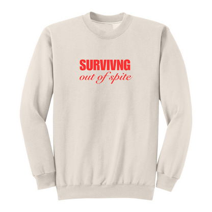 Front view of a natural crewneck sweatshirt featuring the phrase "SURVIVING" in bold red block letters above the words "out of spite" in elegant red script centered on the chest. The clean, minimalist design stands out against the black fabric, creating a bold statement sweatshirt with a resilient and motivational aesthetic.
