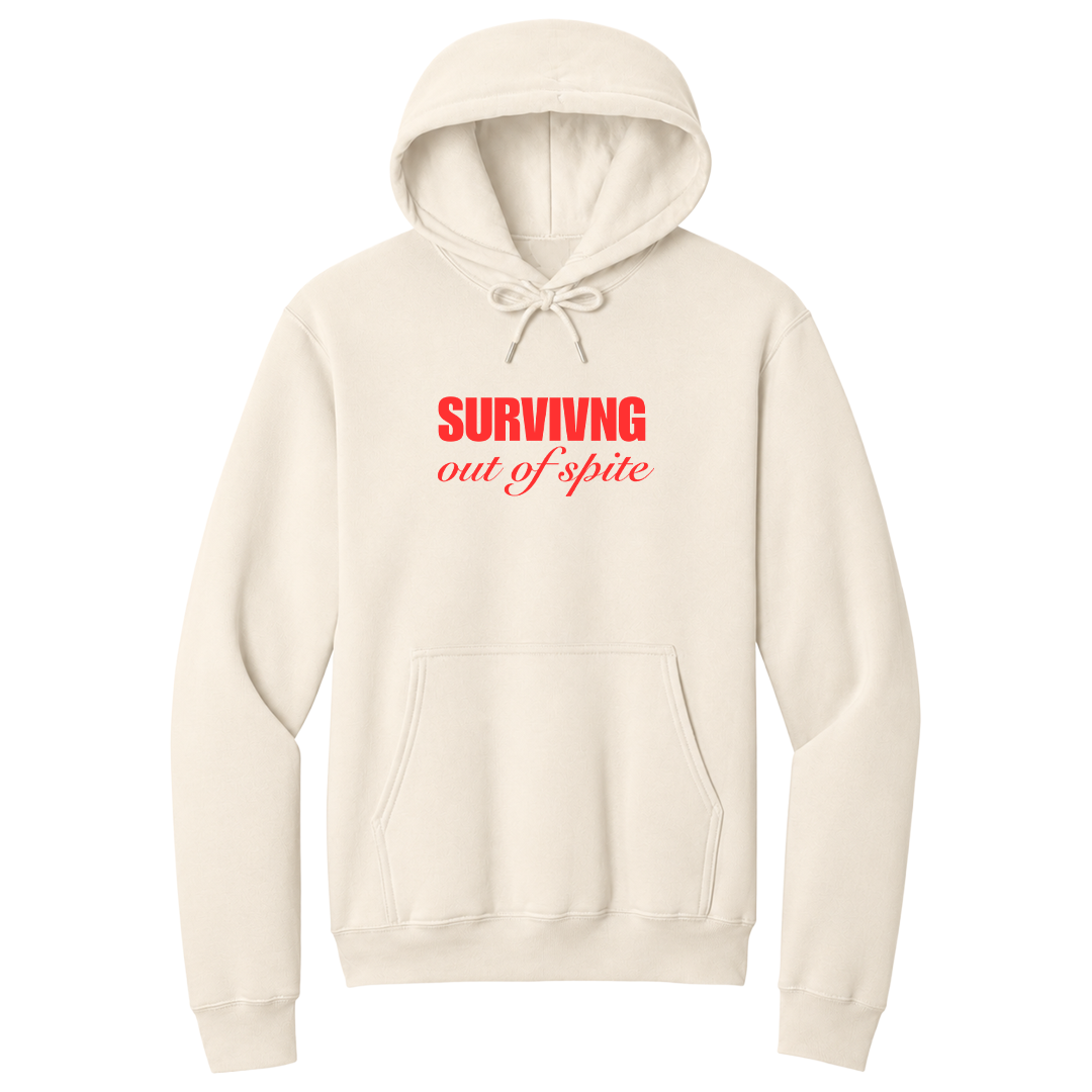Front view of a natural pullover hoodie featuring the phrase "SURVIVING" in bold red block letters above the words "out of spite" in elegant red script centered on the chest. The minimalist motivational graphic contrasts sharply against the black fabric, creating a clean, modern hoodie with a witty and resilient statement design.