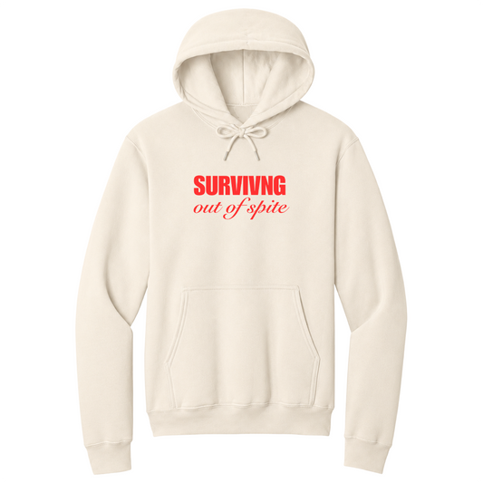 Front view of a natural pullover hoodie featuring the phrase "SURVIVING" in bold red block letters above the words "out of spite" in elegant red script centered on the chest. The minimalist motivational graphic contrasts sharply against the black fabric, creating a clean, modern hoodie with a witty and resilient statement design.