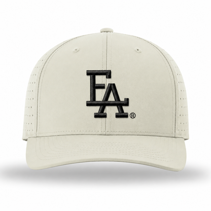 Light tan performance baseball cap featuring a white embroidered “FLA” logo on the front, perforated side panels for breathability, and a structured crown with a curved brim.