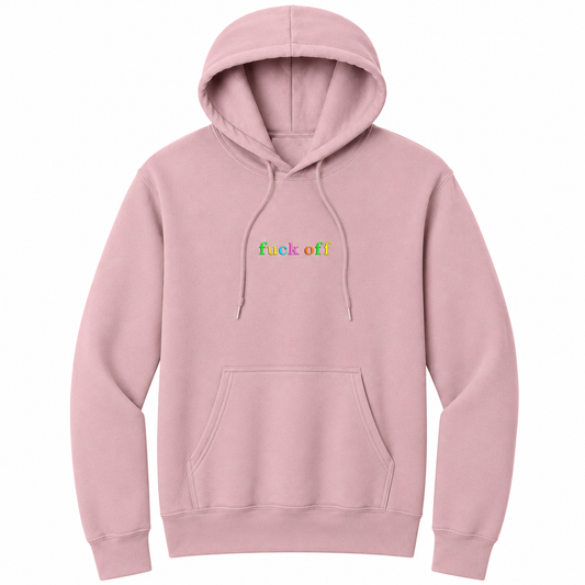 Front view of a pale blush pullover hoodie featuring the phrase "fuck off" in small lowercase letters across the chest. Each letter is embroidered in a different bright color, creating a subtle rainbow-inspired design with a clean, minimalist look. The drawstrings naturally drape over the graphic for a realistic product mockup. A bold adult hoodie with colorful typography, casual streetwear style, and sarcastic humor.