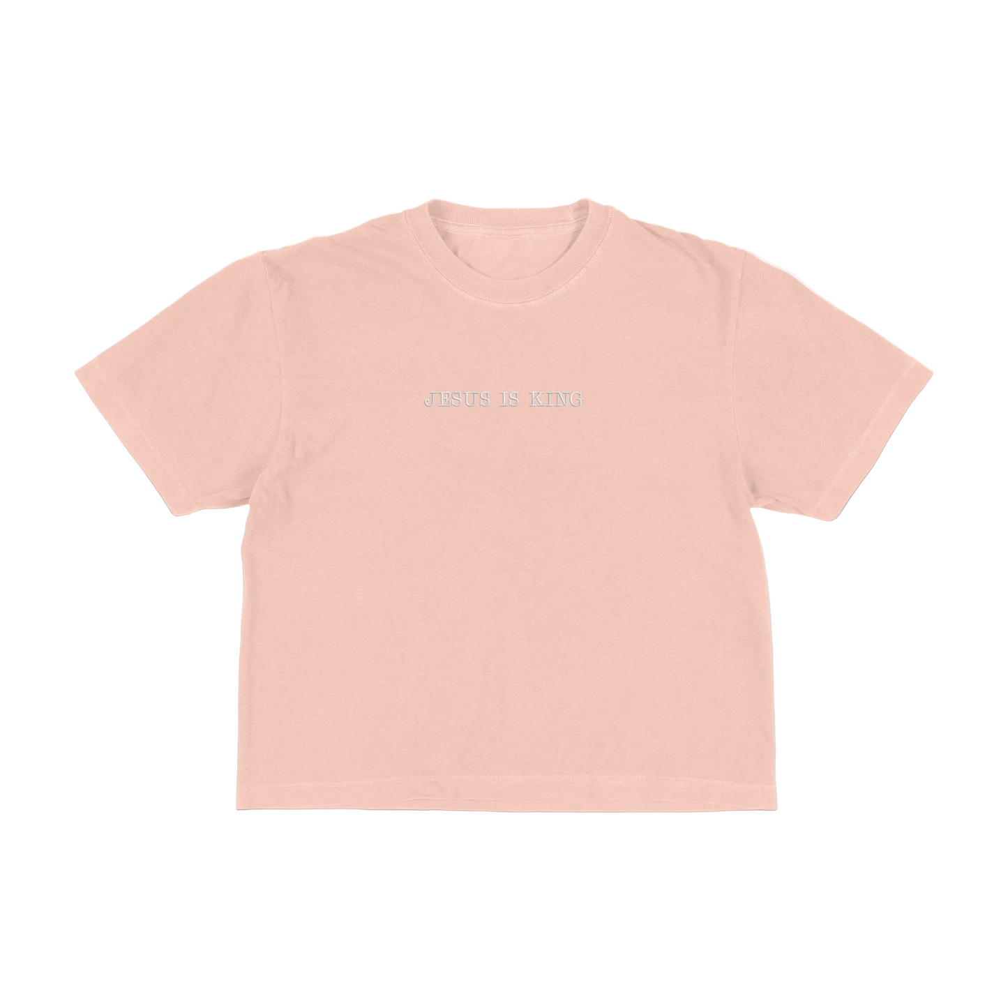 Peach boxy tee with 'Jesus Is King' text on a white background
