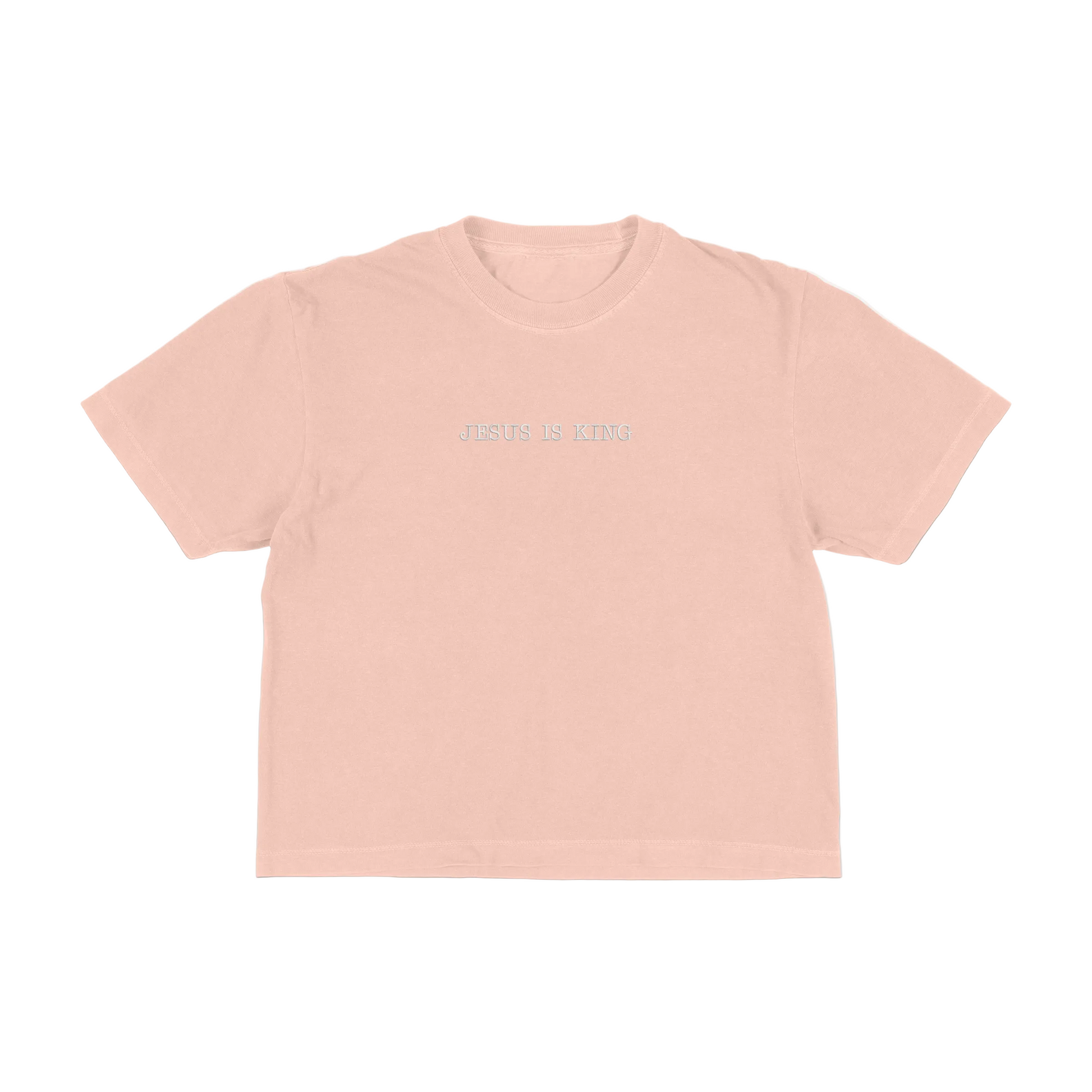 Peach boxy tee with 'Jesus Is King' text on a white background