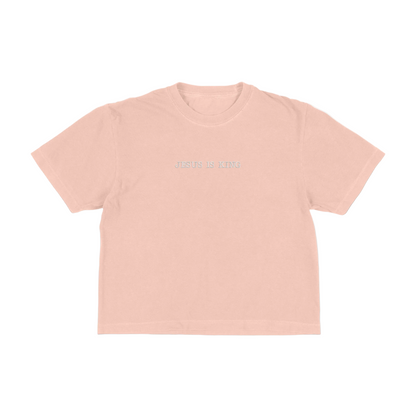 Peach boxy tee with 'Jesus Is King' text on a white background