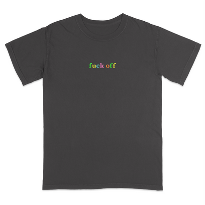 Front view of a pepper T-shirt featuring the phrase "fuck off" in small lowercase letters across the chest. Each letter is embroidered in a different bright color, creating a subtle rainbow-inspired design with a minimalist aesthetic. A bold statement tee for adults with a sarcastic sense of humor, casual streetwear style, and colorful typography.