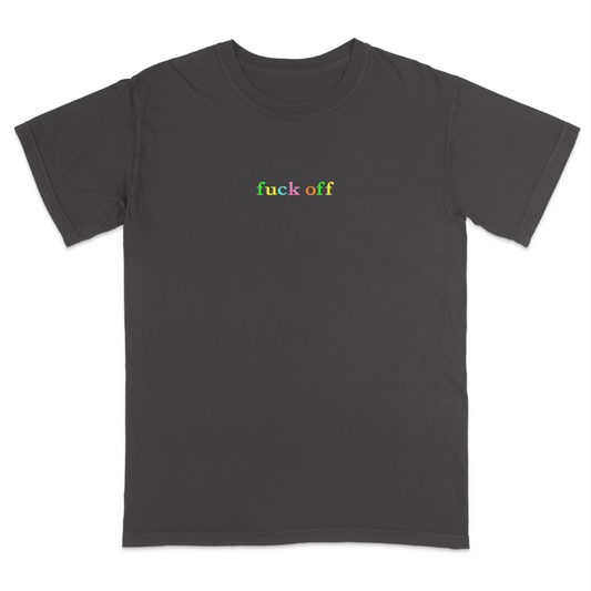 Front view of a pepper T-shirt featuring the phrase "fuck off" in small lowercase letters across the chest. Each letter is embroidered in a different bright color, creating a subtle rainbow-inspired design with a minimalist aesthetic. A bold statement tee for adults with a sarcastic sense of humor, casual streetwear style, and colorful typography.