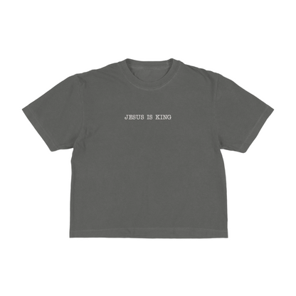 Dark gray boxy tee with 'Jesus Is King' text on a white background