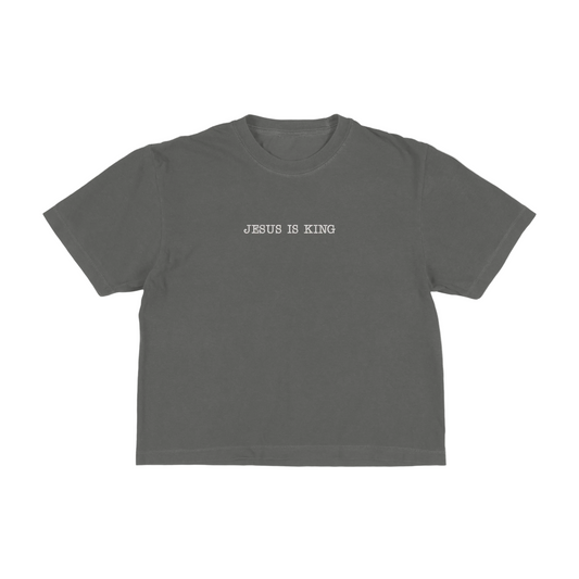 Dark gray boxy tee with 'Jesus Is King' text on a white background