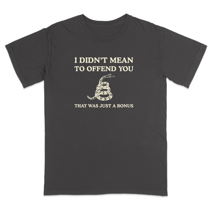 Front view of a pepper graphic T-shirt featuring the humorous phrase "I DIDN'T MEAN TO OFFEND YOU" above a coiled rattlesnake illustration and the text "THAT WAS JUST A BONUS." This vintage-inspired graphic tee combines bold typography with Western-style artwork for a funny, sarcastic everyday shirt.