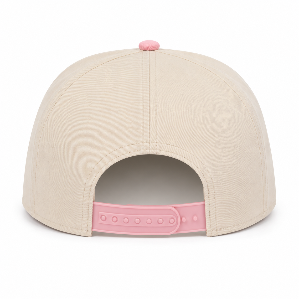 Back view of a cream snapback hat featuring a pink top button and an adjustable pink snapback closure. Displayed on a white background, showcasing the clean rear design and structured fit.