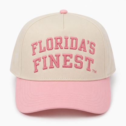 Front view of a cream snapback hat featuring raised pink "Florida's Finest" embroidery with a matching TM symbol and a pastel pink curved bill. Displayed on a white background, highlighting the soft two-tone design and premium embroidered details.