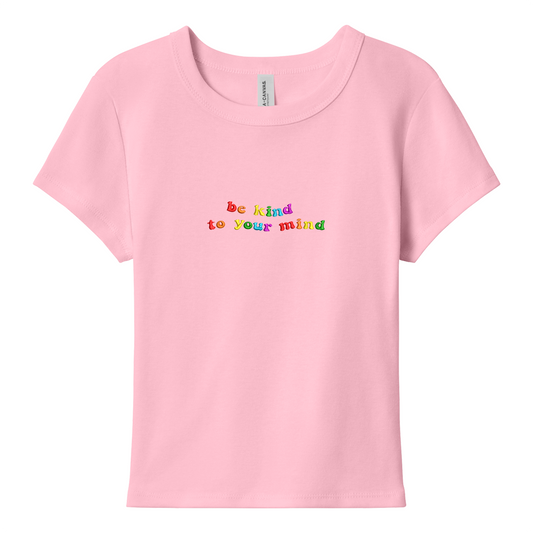 Pink baby tee with 'be kind to your mind' text in colorful letters on a white background