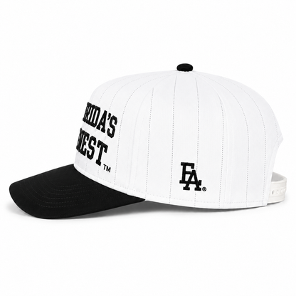 Side view of a white pinstripe snapback hat featuring bold embroidered "Florida's Finest™" lettering on the front and a black embroidered FLA® logo on the side panel. The structured cap has subtle black pinstripes, a black curved brim, black top button, and adjustable white snapback closure, combining a clean vintage baseball-inspired design with modern Florida streetwear style.