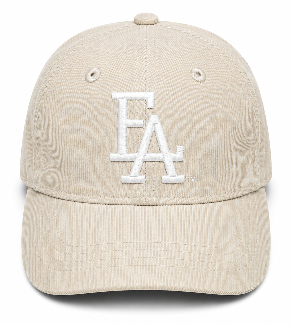 Stone corduroy baseball cap featuring a white embroidered “FLA” logo on the front, textured fabric, and a classic curved brim for a vintage-inspired streetwear look.