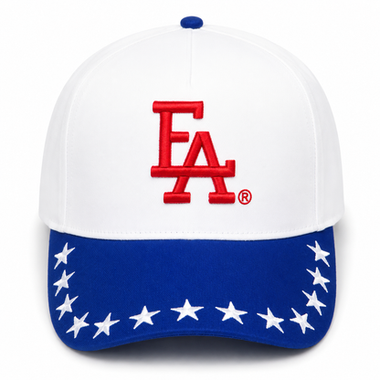 White and royal blue patriotic snapback hat featuring a bold red FLA® embroidered logo, blue brim with white embroidered stars, and a clean Americana-inspired design.
