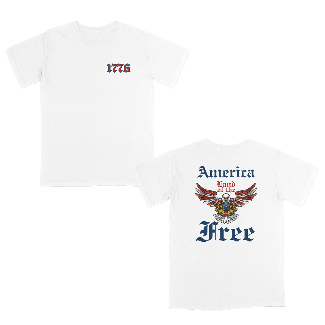Patriotic Americana White graphic tee featuring a bold eagle crest with “America Land of the Free” gothic typography on the back and a vintage-style “1776” front chest design for a classic freedom-inspired look.