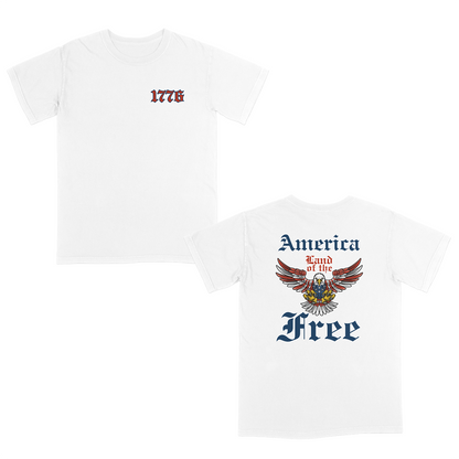 Patriotic Americana White graphic tee featuring a bold eagle crest with “America Land of the Free” gothic typography on the back and a vintage-style “1776” front chest design for a classic freedom-inspired look.