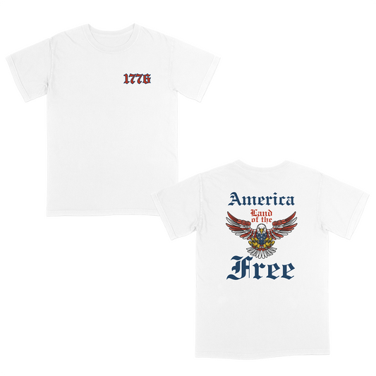Patriotic Americana White graphic tee featuring a bold eagle crest with “America Land of the Free” gothic typography on the back and a vintage-style “1776” front chest design for a classic freedom-inspired look.