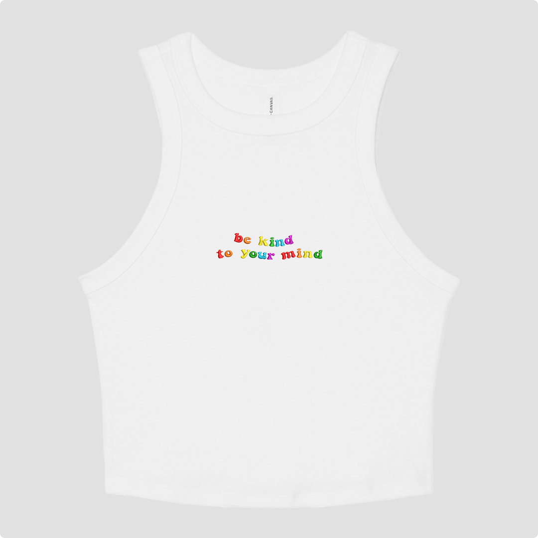 White crop tank top with 'be kind to your mind' text in colorful letters on a white background