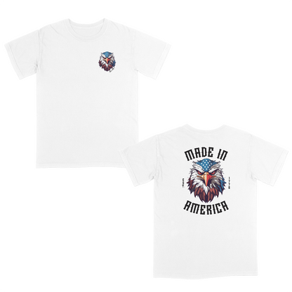 White patriotic graphic tee featuring a fierce bald eagle with an American flag bandana and bold “Made in America” gothic lettering, celebrating classic USA pride and heritage-inspired style.