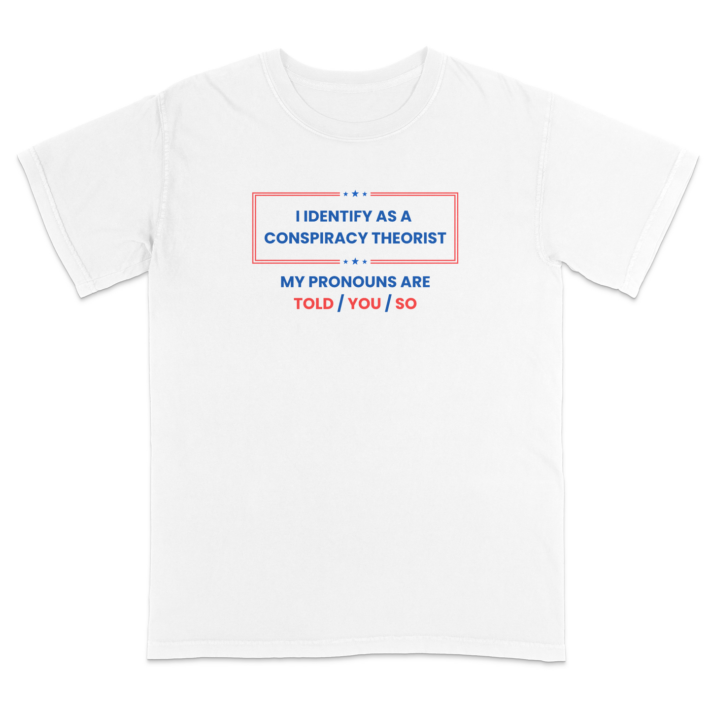 Front view of a white graphic T-shirt featuring the humorous phrase "I Identify as a Conspiracy Theorist" with "My Pronouns Are Told / You / So" printed below in bold patriotic red and blue lettering with stars and a bordered design. A funny political humor tee perfect for casual wear, parties, holidays, and anyone who enjoys satire and conspiracy-themed jokes.