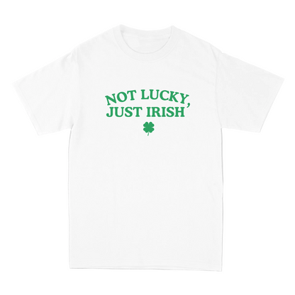 White t-shirt with 'Not Lucky, Just Irish' text and shamrock on a gray background