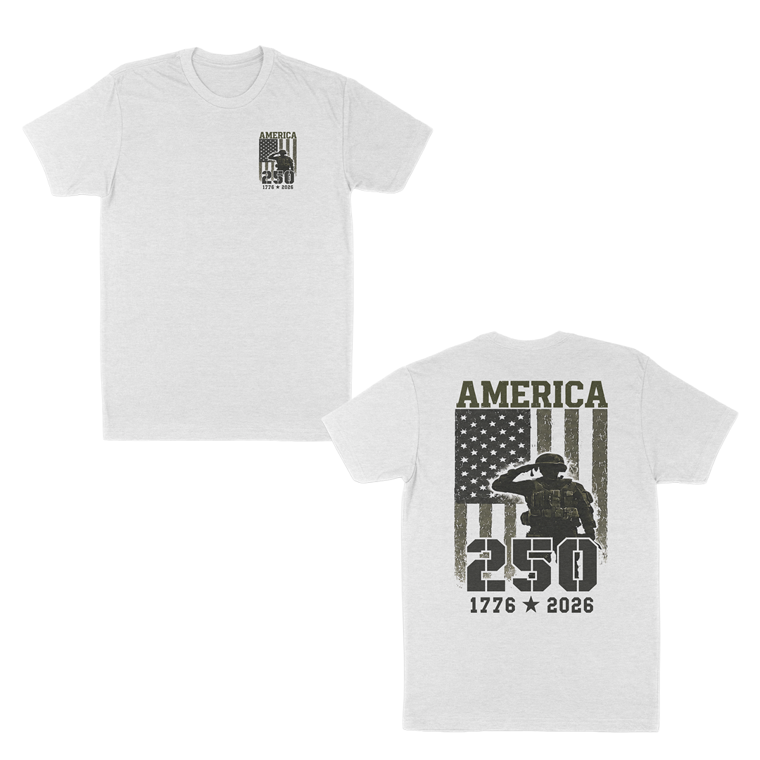 White patriotic military graphic t-shirt featuring a small “America 250” chest print and large back design with saluting soldier, distressed American flag, and “1776–2026” anniversary artwork.