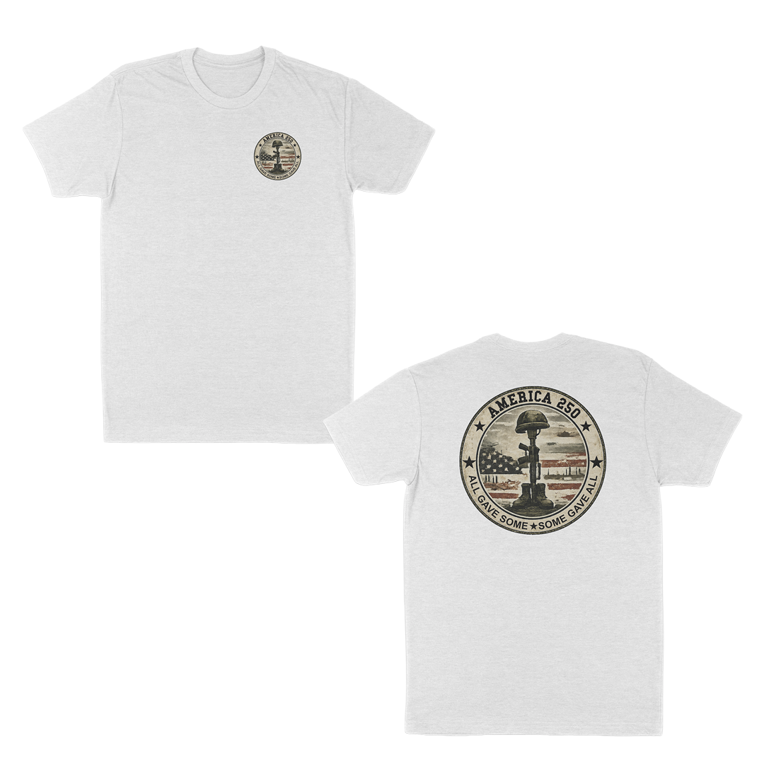 White patriotic memorial t-shirt featuring a small front chest badge and large back graphic with battlefield cross memorial, distressed American flag, “America 250” design, and “All Gave Some • Some Gave All” tribute text.