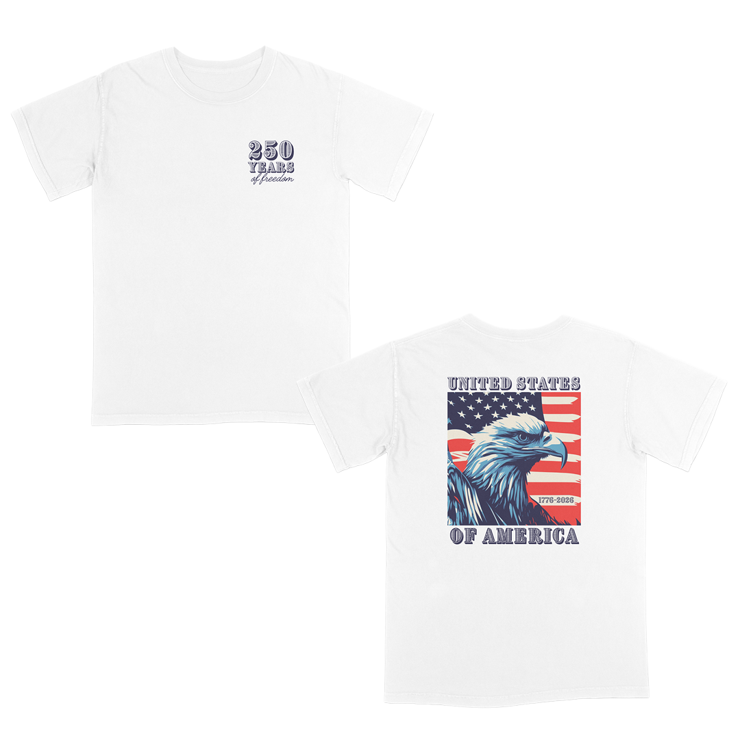 Patriotic Americana graphic tee featuring a bold eagle and American flag back print with “United States of America” typography and a “250 Years of Freedom” front chest design celebrating 1776–2026.