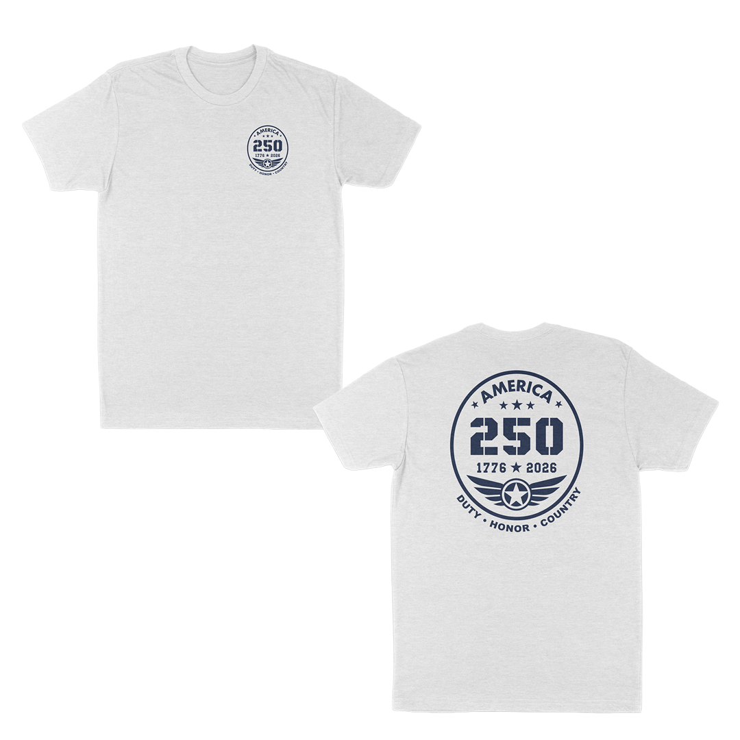 White patriotic America 250 anniversary t-shirt featuring a small front chest badge and large back emblem with “1776–2026” commemorative design, aviation-inspired wing graphic, and “Duty • Honor • Country” military tribute text.
