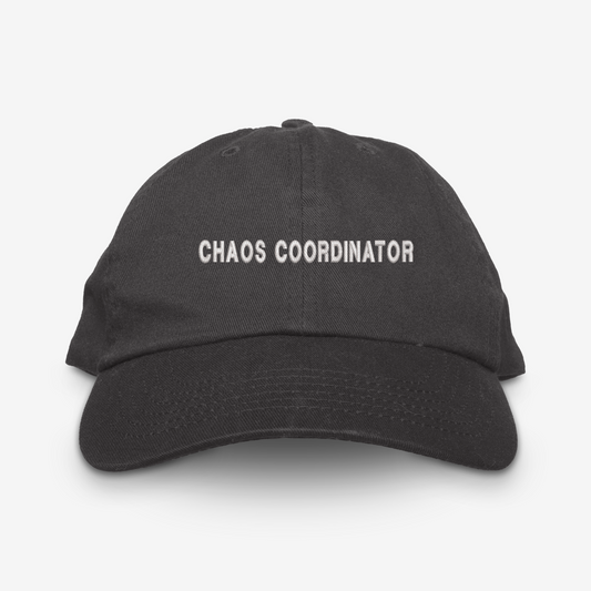 Black cap with 'CHAOS COORDINATOR' text on a white background