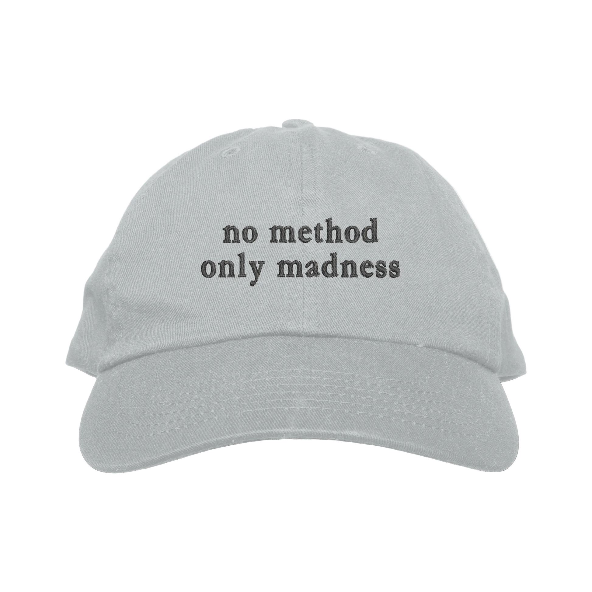 Gray cap with 'no method only madness' text on a white background