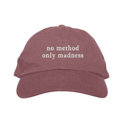 Maroon cap with 'no method only madness' text on a white background