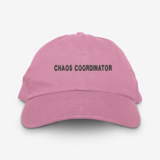 Pink cap with 'CHAOS COORDINATOR' text on a white background
