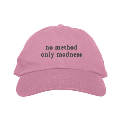 Pink cap with 'no method only madness' text on a white background